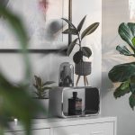 Stylish indoor space with lush houseplants and modern decor elements in natural light.